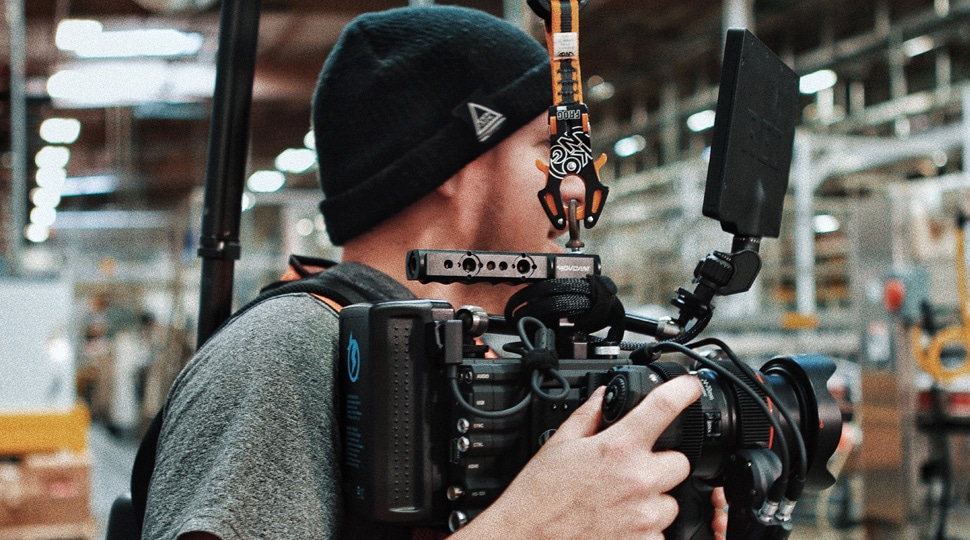 camera man holding camera tech